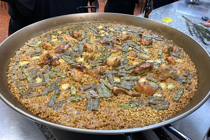 Valencian Paella Cooking Class, Tapas & Sangria - Evening - Preparing paella with the group